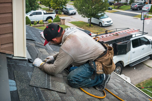 Professional Roofing technician working in Lee, NH
